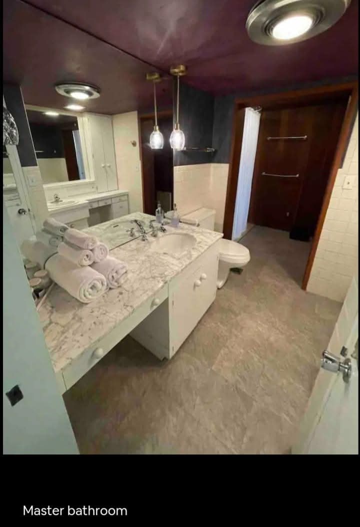Master bathroom staged with hotel folds
